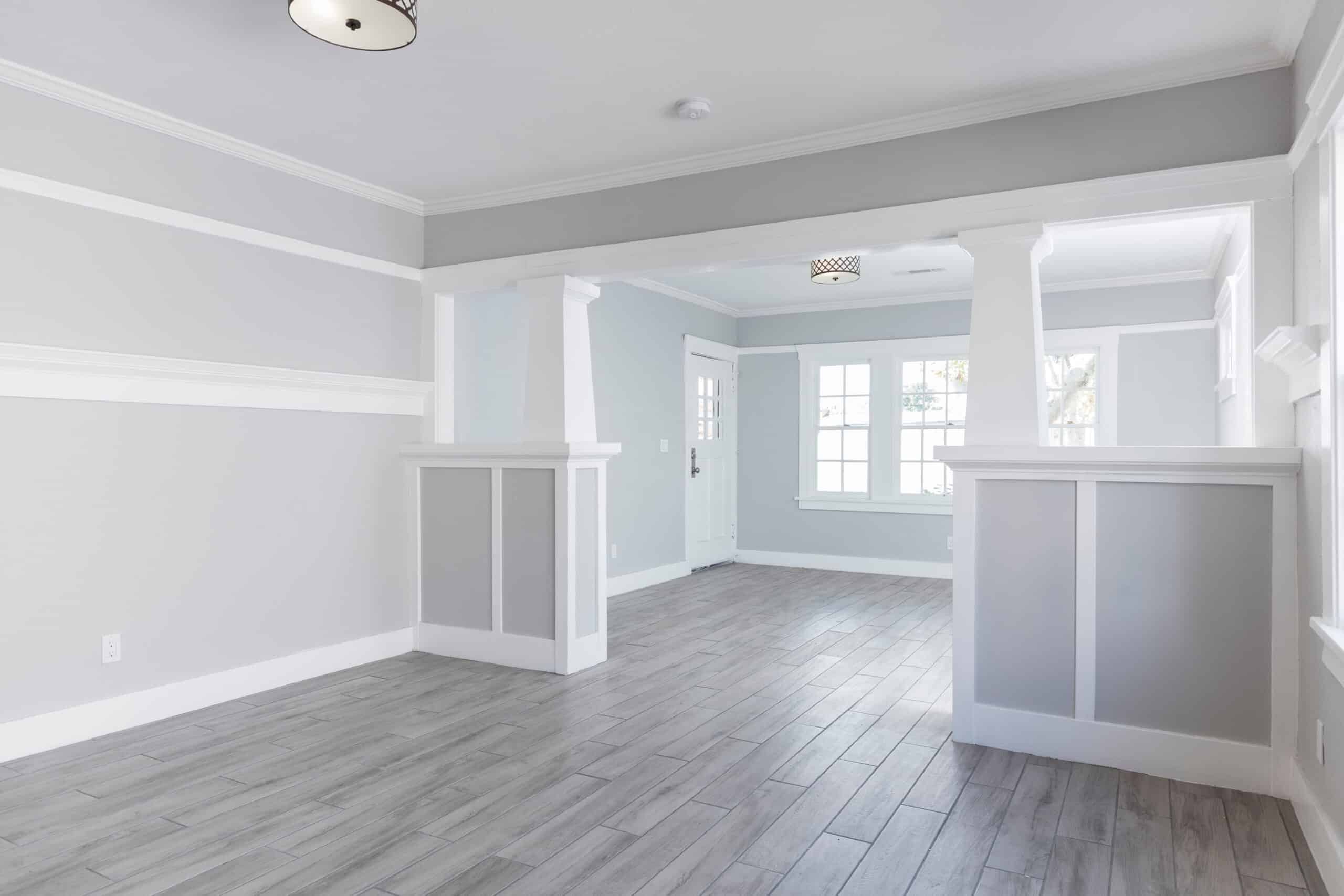 Living Room interior after remodelling with fire place and grey